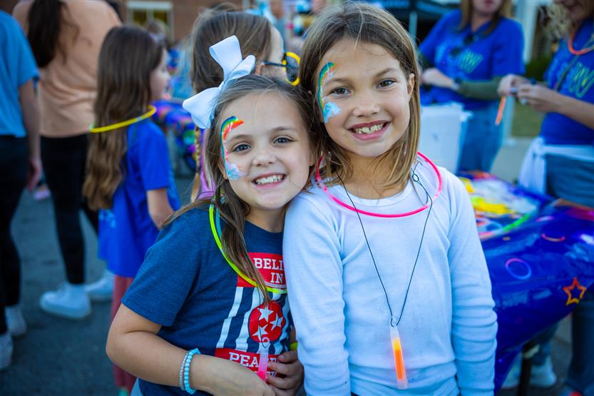 Two girls smile